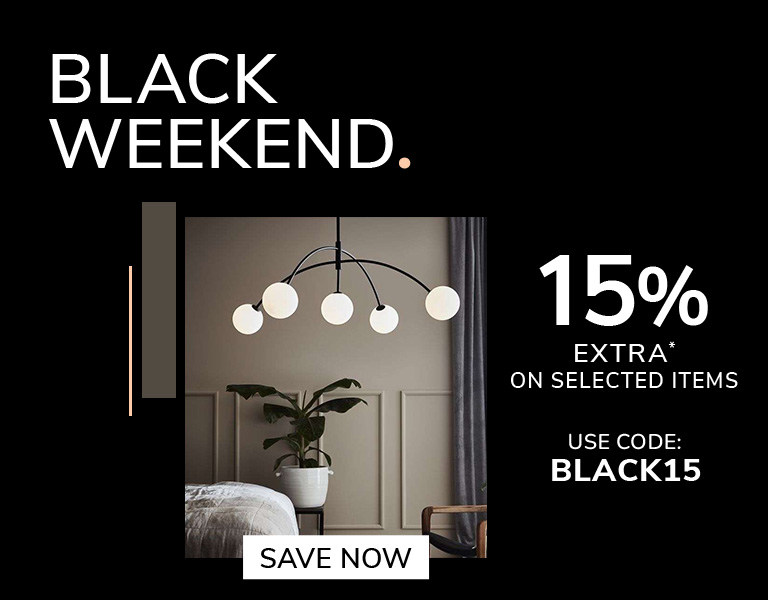A modern interior scene featuring a decorative wooden floor lamp glowing warmly beside a beige sofa. On the right, bold promotional text reads “Black Savings. Now 13% Extra on Selected Items. Use code: BLACK13,” with a button saying “Save Now.” The design
